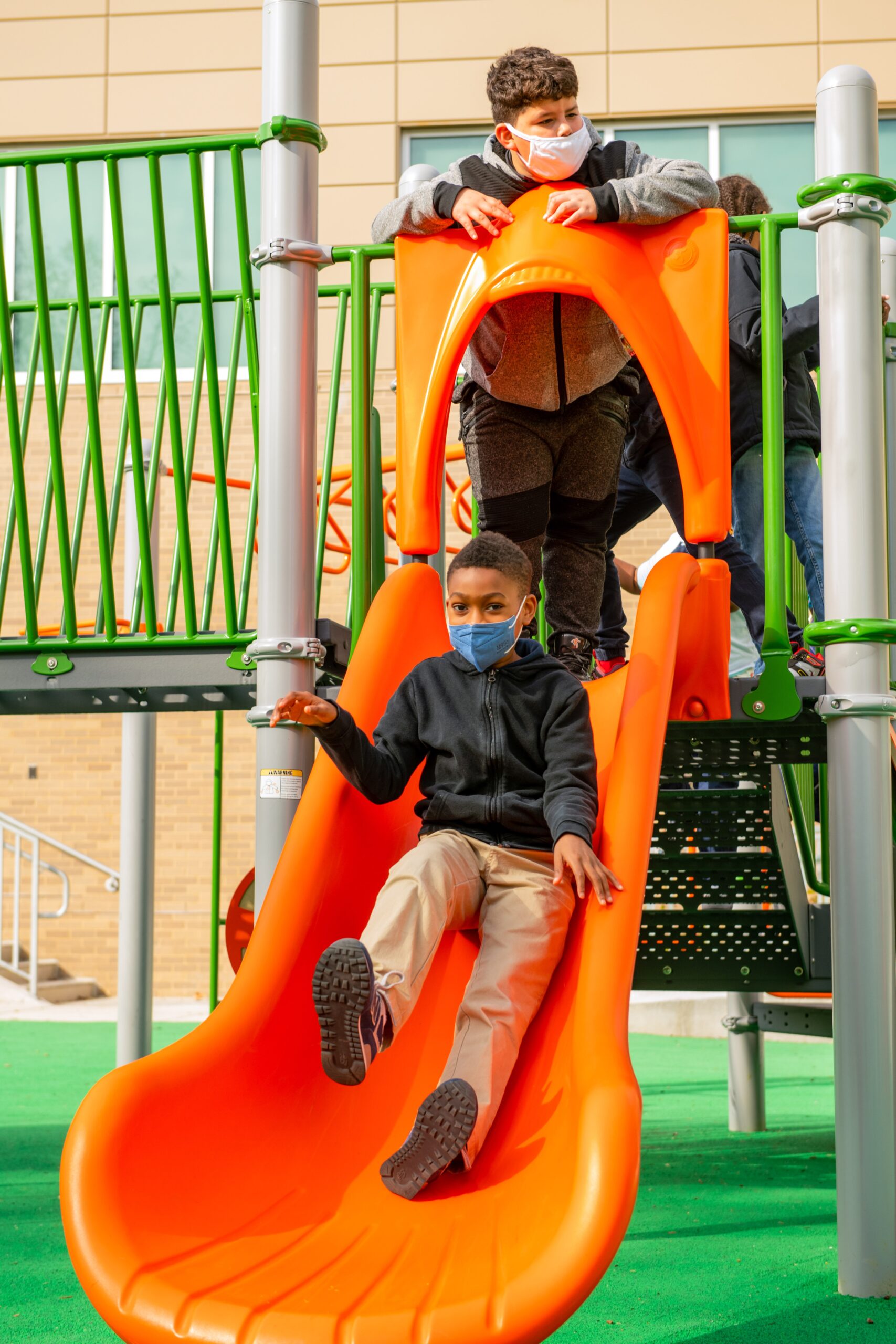 going down slide on playground