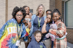 students and teacher outside school